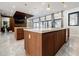 Modern kitchen featuring an island with stainless steel appliances and access to the living room at 1812 Hunters Gln, Marietta, GA 30062