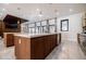 Modern kitchen featuring an island with stainless steel appliances and access to the living room at 1812 Hunters Gln, Marietta, GA 30062