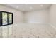 Spacious living room with a large sliding glass door that lets in plenty of natural light and elegant marble floors at 1812 Hunters Gln, Marietta, GA 30062
