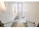 Bright, naturally lit staircase with glass railing and modern lighting fixtures at 1812 Hunters Gln, Marietta, GA 30062