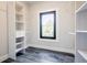 Walk-in closet with custom shelving and a large window at 1812 Hunters Gln, Marietta, GA 30062
