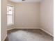 Bedroom with natural light features carpeted flooring and single window at 10 Perimeter Summit Ne Blvd # 3204, Atlanta, GA 30319