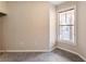 Bedroom with natural light features carpeted flooring and single window at 10 Perimeter Summit Ne Blvd # 3204, Atlanta, GA 30319