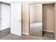 Neutral bedroom with carpet, mirrored closet doors, and open entry to the left at 10 Perimeter Summit Ne Blvd # 3204, Atlanta, GA 30319