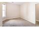 Neutral bedroom features carpeted flooring and single window at 10 Perimeter Summit Ne Blvd # 3204, Atlanta, GA 30319