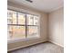 Bedroom with large window offering exterior view, features carpeted flooring at 10 Perimeter Summit Ne Blvd # 3204, Atlanta, GA 30319
