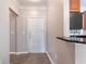 Light and bright entrance featuring door, kitchen, and bar area at 10 Perimeter Summit Ne Blvd # 3204, Atlanta, GA 30319
