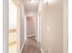 Hallway featuring hardwood floors and neutral paint, leading to rooms with natural light at 10 Perimeter Summit Ne Blvd # 3204, Atlanta, GA 30319