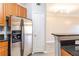 Eat-in kitchen has stainless steel appliances, granite counters, and wood cabinets at 10 Perimeter Summit Ne Blvd # 3204, Atlanta, GA 30319