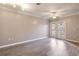 Bright living room boasts a ceiling fan, doors to balcony and hardwood floors at 10 Perimeter Summit Ne Blvd # 3204, Atlanta, GA 30319