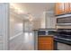 Inviting living room featuring hardwood floors and sliding glass doors to outdoor balcony at 10 Perimeter Summit Ne Blvd # 3204, Atlanta, GA 30319