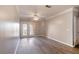 Open living area featuring doors to balcony and stylish hardwood flooring at 10 Perimeter Summit Ne Blvd # 3204, Atlanta, GA 30319