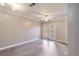 Bright living room with doors to balcony and stylish hardwood flooring at 10 Perimeter Summit Ne Blvd # 3204, Atlanta, GA 30319