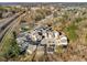 Aerial view of a residential neighborhood surrounded by trees and railroad tracks at 1872 Commons Nw Pl, Atlanta, GA 30318