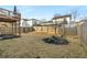Spacious backyard with grass, mulched landscaping, and a wood privacy fence at 1872 Commons Nw Pl, Atlanta, GA 30318
