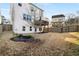Spacious backyard featuring a wood privacy fence and a view of a two-story deck at 1872 Commons Nw Pl, Atlanta, GA 30318