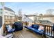 Outdoor deck with wooden floor, blue furniture and barbecue grill at 1872 Commons Nw Pl, Atlanta, GA 30318