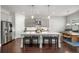 Spacious kitchen featuring a large island with seating, stainless steel appliances, and ample counter space at 1872 Commons Nw Pl, Atlanta, GA 30318