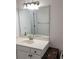 Bathroom with a large mirror, white vanity, and modern fixtures at 2201 Pine Heights Ne Dr, Atlanta, GA 30324