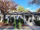 Exterior view of the clubhouse, with well-maintained landscaping and an EV charging station at 2201 Pine Heights Ne Dr, Atlanta, GA 30324