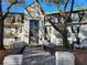 Building with a large window facade, beautiful stone detail, and well-maintained landscaping at 2201 Pine Heights Ne Dr, Atlanta, GA 30324