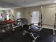 Well-equipped gym featuring weightlifting machines, dumbbells, and mirrors for a complete workout experience at 2201 Pine Heights Ne Dr, Atlanta, GA 30324