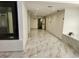 Clean hallway with marble floors, recessed lighting, and an elevator enhances the community's appeal at 2201 Pine Heights Ne Dr, Atlanta, GA 30324