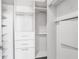 Bright walk-in closet features multiple shelves and storage options at 2626 Peachtree Nw Rd # 1102, Atlanta, GA 30305