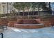 Charming courtyard with a brick fountain and comfortable seating at 2626 Peachtree Nw Rd # 1102, Atlanta, GA 30305