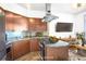 Kitchen featuring granite countertops, stainless appliances, and an open-concept design leading to the living area at 2626 Peachtree Nw Rd # 1102, Atlanta, GA 30305