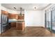 Bright living space features hardwood floors, recessed lighting, and a kitchen with stainless appliances at 2626 Peachtree Nw Rd # 1102, Atlanta, GA 30305