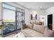 Bright living room with large windows, a view, comfortable seating, and dining area at 2626 Peachtree Nw Rd # 1102, Atlanta, GA 30305