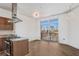 Open-concept living area featuring hardwood floors and a sliding glass door with city views at 2626 Peachtree Nw Rd # 1102, Atlanta, GA 30305
