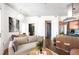 Cozy living room and kitchen with stainless appliances, granite counters, and a dining area at 2626 Peachtree Nw Rd # 1102, Atlanta, GA 30305