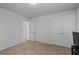 Simple bedroom features neutral walls, carpeted floors, and double-door closet for ample storage at 5512 Cascade Sw Run, Atlanta, GA 30336