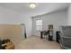 Bedroom features neutral walls, carpet, and window with natural light at 5512 Cascade Sw Run, Atlanta, GA 30336