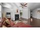 Cozy living room boasts a fireplace, neutral paint, and hardwood floors for a warm and inviting feel at 5512 Cascade Sw Run, Atlanta, GA 30336