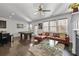 Open-concept living area features a kitchen island, pool table, and comfortable seating area at 5512 Cascade Sw Run, Atlanta, GA 30336