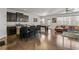 Open-concept living space with a modern kitchen island, pool table, and comfortable leather sofa at 5512 Cascade Sw Run, Atlanta, GA 30336