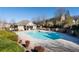 Community pool with outdoor seating and well-maintained landscaping at 5512 Cascade Sw Run, Atlanta, GA 30336