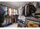 Organized walk-in closet filled with clothing and accessories at 5512 Cascade Sw Run, Atlanta, GA 30336