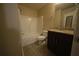 Well-lit bathroom featuring shower-tub combo and granite vanity at 951 Plaza Park Walk # 50, Kennesaw, GA 30144