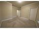 Spacious carpeted bedroom featuring neutral walls, white trim, and a double-door closet at 951 Plaza Park Walk # 50, Kennesaw, GA 30144