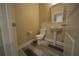 Bathroom featuring pedestal sink, toilet, and hardwood flooring at 951 Plaza Park Walk # 50, Kennesaw, GA 30144