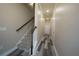 Hallway with hardwood flooring, stairway with carpet, and doors at 951 Plaza Park Walk # 50, Kennesaw, GA 30144