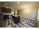 Kitchen with stainless steel appliances, island, granite countertops, and hardwood floors at 951 Plaza Park Walk # 50, Kennesaw, GA 30144