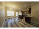 Kitchen and dining area with stainless steel appliances, island, and hardwood floors at 951 Plaza Park Walk # 50, Kennesaw, GA 30144