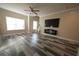 Living room with fireplace, large windows and hardwood floors at 951 Plaza Park Walk # 50, Kennesaw, GA 30144