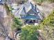 Stunning aerial view of home, beautiful landscaping, stone patio, and outdoor living space at 955 Golf View Ct, Dacula, GA 30019