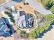 Aerial view of home showcasing landscaping, backyard patio, and stone details at 955 Golf View Ct, Dacula, GA 30019